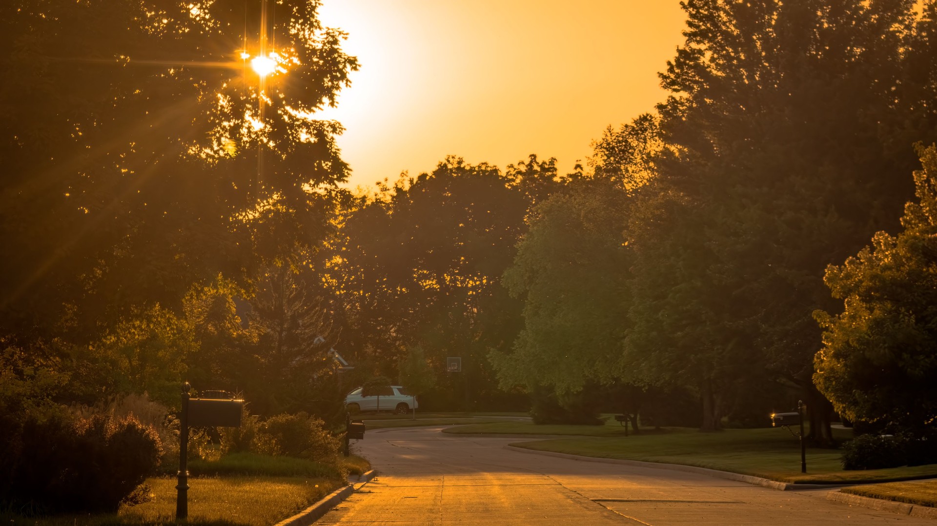 View of Midwestern suburban neighborhood at sunset in summer